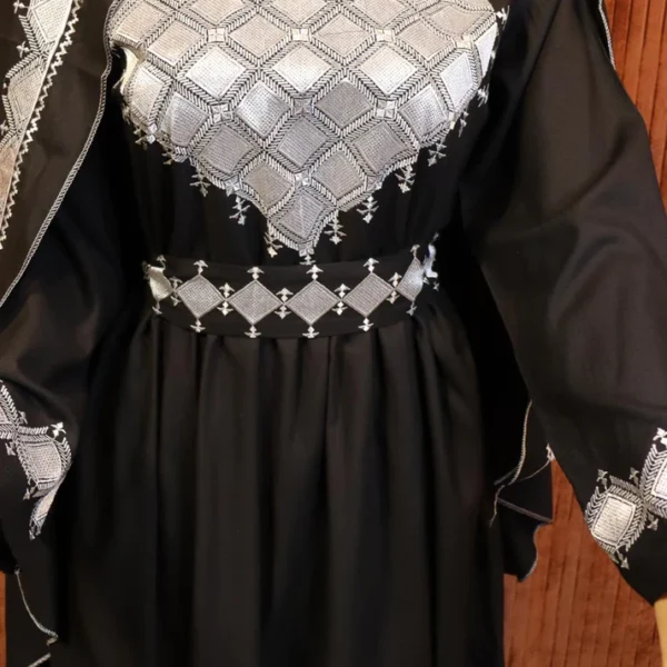 Black Hazaragi dress by Zeenat Wears, featuring traditional Afghan design and intricate details, perfect for cultural events and special occasions.