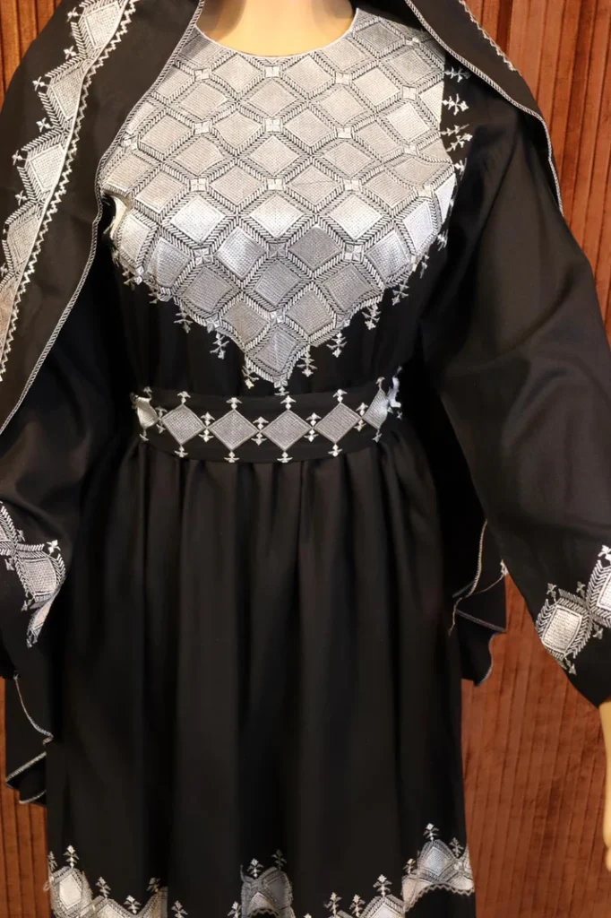 Black Hazaragi dress by Zeenat Wears, featuring traditional Afghan design and intricate details, perfect for cultural events and special occasions.