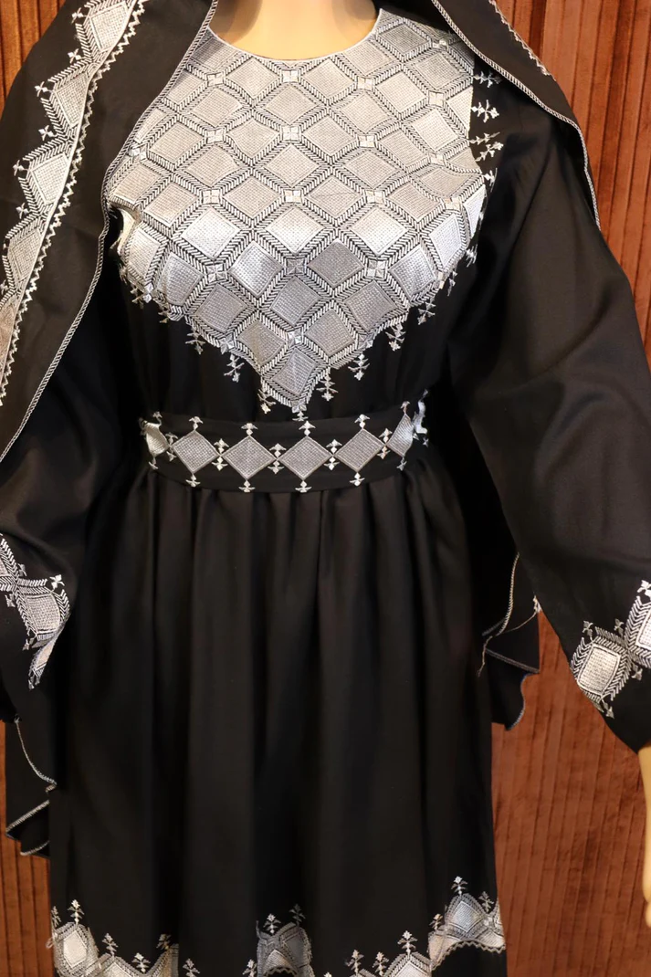 Black Hazaragi dress by Zeenat Wears, featuring traditional Afghan design and intricate details, perfect for cultural events and special occasions.